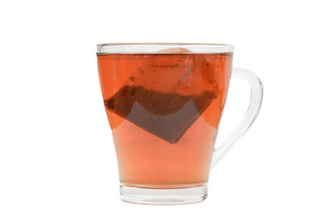 Transparent cup with black tea, cup on a white background, space for inscriptions