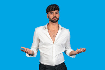 Confident young man gesturing in uncertainty