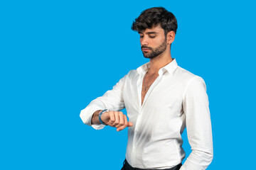 Young professional checking time on wristwatch