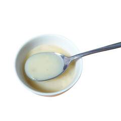 A curated collection of wholesome and savory cream soup with a spoon in a bowl.

