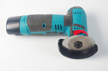 Portable grinder with saw blade.