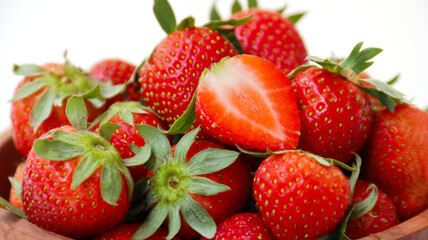 close up of ripe strawberries with white background. Harvesting time