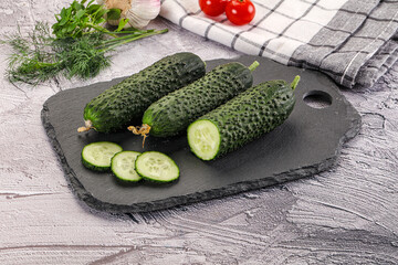 Raw green cucumbers with slices