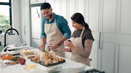 Cooking, Thanksgiving and couple in home with turkey for meal prep, dinner and festive lunch. Kitchen, talking and man with woman with ingredients, recipe and food for nutrition, dish and cuisine