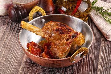 Baked lamb shank with vegetables