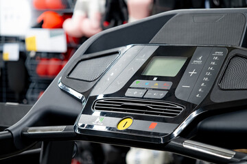 Modern treadmill console with digital display monitor screen. Sport equipment for indoor running...