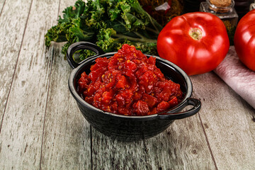 Diced ripe tomato with sauce