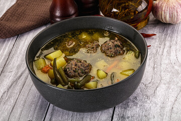 Soup with beef meatballs and vegetables