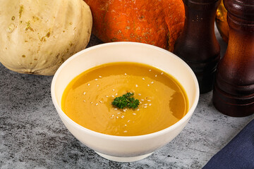Vegan pumpkin cream soup served sesam
