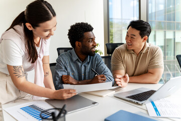 Marketing team discussing new project during meeting in modern office