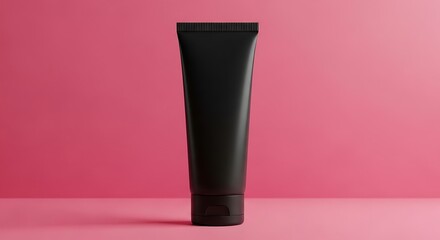 Sleek Black Cosmetic Tube Mockup Against a Vibrant Pink Backdrop for Beauty and Personal Care Product Advertising
