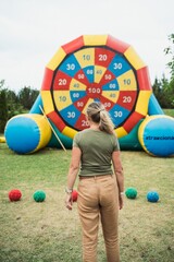 Outdoor sports competitions – participants engage in running, relay races, football, volleyball, and other physical activities. Active movement, teamwork, energy, and excitement in an open-air setting