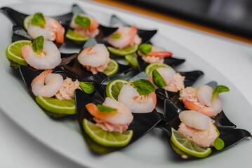 Assorted bite-sized appetizers – beautifully presented mini sandwiches, cheese and meat bites, vegetable skewers, and savory snacks. Perfect for parties, buffets, weddings, or corporate events.