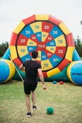 Outdoor sports competitions – participants engage in running, relay races, football, volleyball, and other physical activities. Active movement, teamwork, energy, and excitement in an open-air setting