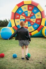 Outdoor sports competitions – participants engage in running, relay races, football, volleyball, and other physical activities. Active movement, teamwork, energy, and excitement in an open-air setting