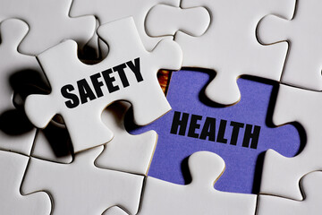 Fototapeta premium Safety and Health Puzzle Pieces Interlocking to Represent Security and Well-being in a Connected System with White Jigsaw