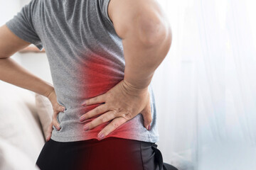 Sciatica Pain and Herniated Disc Concept ,  Woman Suffering from Lower Back and Buttock Pain...