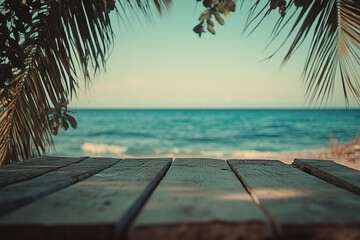 Wooden platform overlooking the vast turquoise ocean beneath palm tree canopy