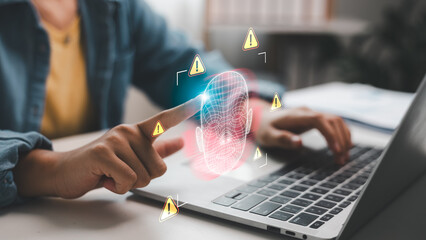 Hand pointing to digital face scan with warning signs, symbolizing deepfake, identity theft, biometric fraud, and AI facial recognition risks. Concept for cybersecurity and data privacy issues.