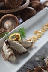 Iron-rich beef wrapped in shiitake mushroom grilled for energy and stamina. A work by Master Chef Hanshunseop. Photographed in Korea.