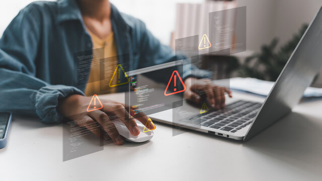 Laptop showing coding errors and warning icons, symbolizing hacker attack, phishing, cyber threat, and malware. Concept for cybersecurity, digital risk, and system vulnerability protection.