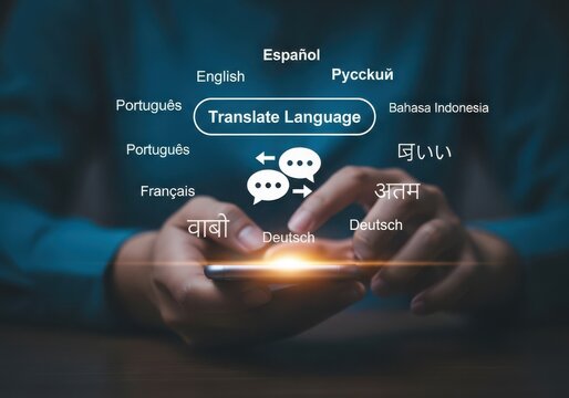 Photo of hands using a smartphone to translate languages, with various language names displayed around the screen, symbolizing global communication and technology