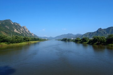 River valley landscape, summer, clear sky, distant mountains, calm water, nature travel