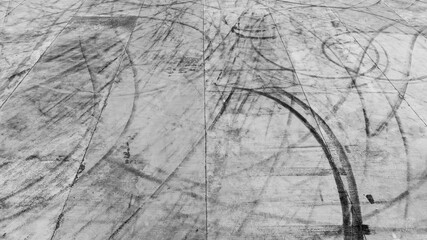 Aerial view car tire marks abstract street road background with black tire marks on race track,...