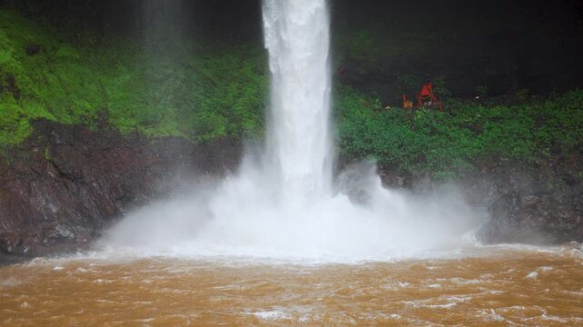4K Slow motion shot of Devkund waterfall during the monsoon season at Raigad district in Maharashtra, India. Scenic view of the waterfall during the rainfall. Natural waterfall in Western Ghats.