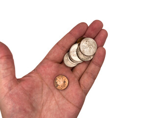 USA coins, US money, pennies, cents, salary in dollars, dollar, mans hand is holding a stack of...