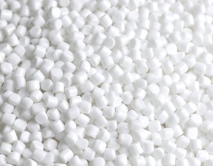 Close-up view of numerous small, uniformly-shaped white pellets