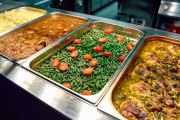 A Delectable Array of Culinary Delights Featuring Chicken, Green Beans, and Herb-Infused Sauces in a Vibrant Buffet Setting