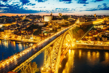 Fototapeta premium Night View of Dom Luis I Bridge and Illuminated Cityscape of Porto, Portugal