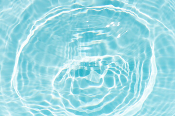 Blue water with ripples on the surface. Defocus blurred transparent blue colored clear calm water...