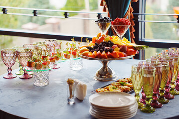 Colorful fruit display and refreshing drinks at elegant banquet setting
