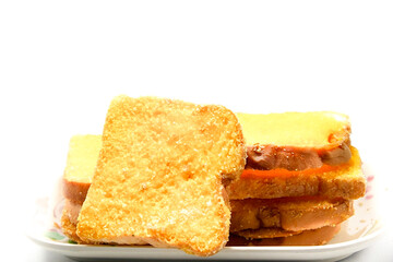 Crispy yellow buttery toast, delicious for morning and evening on a white background.
