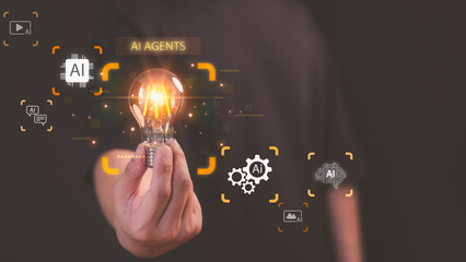 Hand holding glowing light bulb with AI agents icons, symbolizing artificial intelligence, innovation, smart technology, and future digital transformation in business and industry.