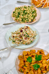A Colorful Display of Freshly Prepared Salads and Seafood Dishes on Elegant Plates, Showcasing Gourmet Culinary Artistry and Vibrant Ingredients for a Delightful Feast