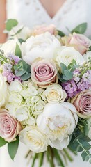 Obraz premium Delicate bouquet of pastel roses, peonies, and hydrangeas.