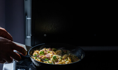 preparing scrambled eggs in the morning