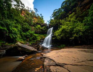 Lush waterfall cascading down rocky terrain