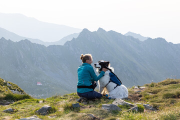 Fototapeta premium trekking with a dog in hogh mountains