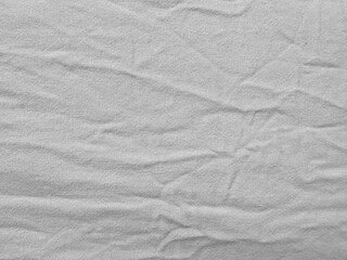 wrinkled light grey cotton fabric texture with natural creases for clothing design or digital textile mockup

