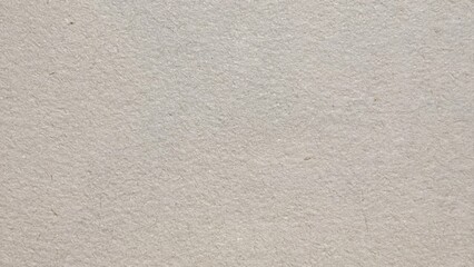 closeup of rough handmade beige mulberry paper texture with natural fiber flecks ideal for...