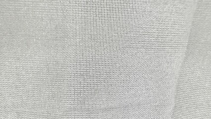 white semi sheer woven curtain close-up with grid weave texture for minimalist interior design or fabric background use

