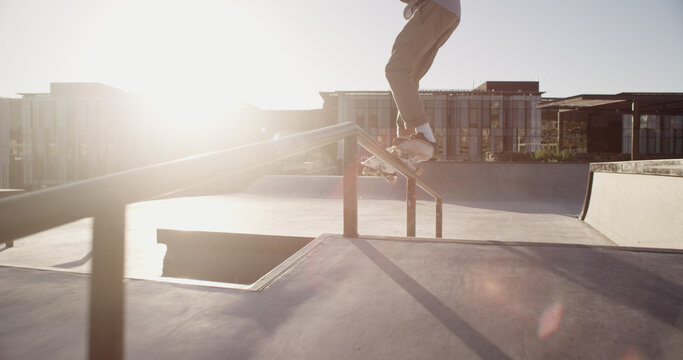 Man, skateboard and stunt with railing, outdoor and fitness with trick, training and extreme sports. Skater, challenge or person with practice, exercise or urban town with hobby, recreation or Canada