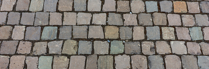 Panoramic image. Old cobblestone pavement
