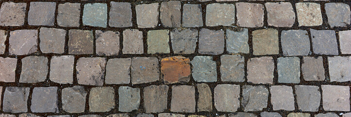 Panoramic image. Old cobblestone pavement