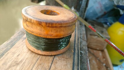 Naklejka premium Handcrafted Wooden Fishing Reel