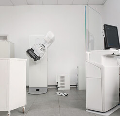 Modern mammography machine in medical examination room, advanced diagnostic equipment for breast...